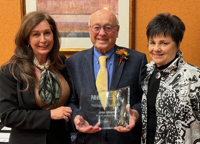 John Mlnarik AMH Board of Trustees President (ctr), is shown with Diane Brugger, AMH CEO (left), and his wife, Barb (right), after being recognized as the NHA 2024 Trustee of the Year.John Mlnarik AMH Board of Trustees President (ctr), is shown with Diane Brugger, AMH CEO (left), and his wife, Barb (right), after being recognized as the NHA 2024 Trustee of the Year.